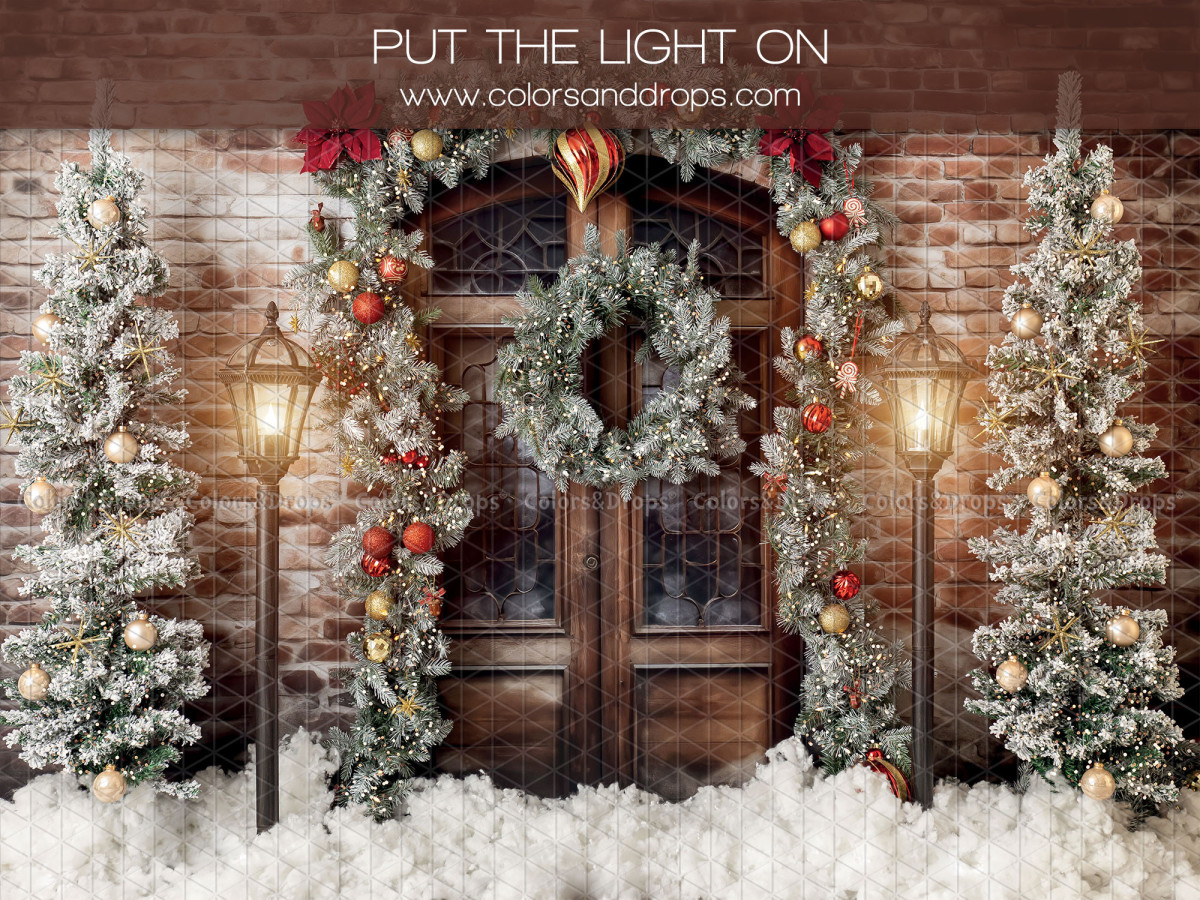 Christmas photo backdrop Put the Light on – wooden door with wreath and lit fir trees on brick | Colors&Drops